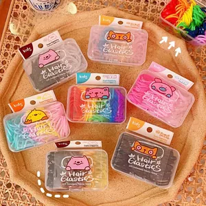 Detailed view of colorful jelly hair elastics in cute animal-themed clear storage boxes