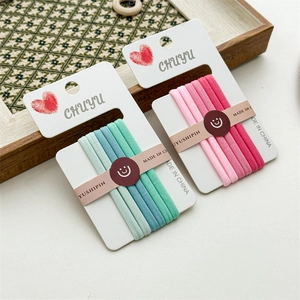 Detailed view of high-elastic seamless hair ties in gradient pink and green color sets
