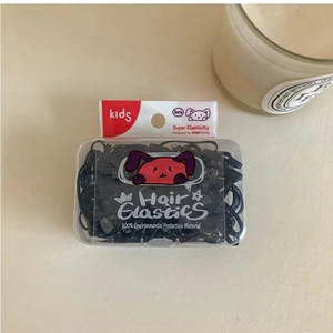 Detail view of black high-elasticity hair elastics in a transparent box for kids