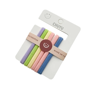 Set of seven colorful elastic candy-colored hair ties neatly displayed on a white card