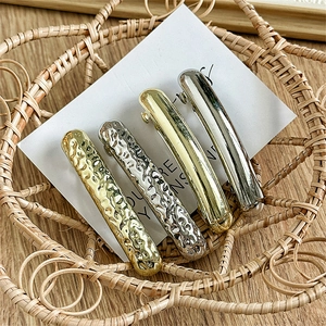 Set of four minimalist gold and silver geometric hair clips with hammered and smooth finish