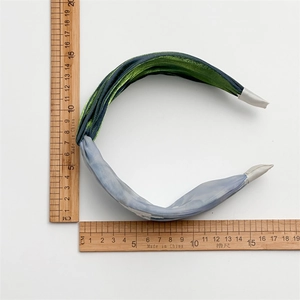 Floral knot headband with gradient green and blue mesh design for high crown styling