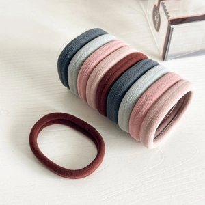 Morandi color high-elasticity seamless hair ties set on white wooden background