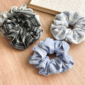 Three-piece retro striped scrunchie set in blue and black with delicate lace trim edges
