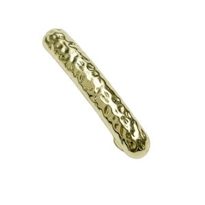 Modern minimalist gold cabinet handle with hand-hammered texture and metallic finish