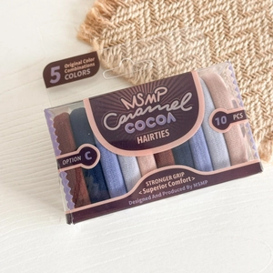 Detail view of 10-piece elastic seamless hair ties in Morandi colors with retail box