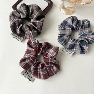 Three-piece vintage plaid scrunchie set with fabric labels in retro color palettes