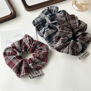 Three-piece set of vintage plaid scrunchies in red, blue, and brown fabric