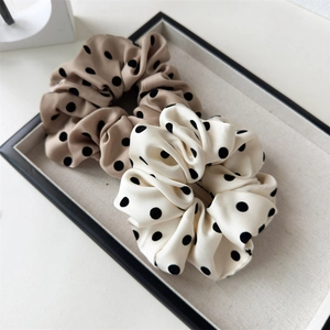 Satin polka dot scrunchie set in beige and cream white for elegant hairstyling