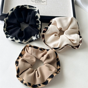 Three-piece set of high-elastic leopard print ruffled scrunchies in neutral tones