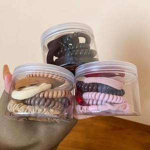 Ten-piece set of elastic phone cord hair ties and scrunchies in transparent jars