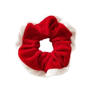 Festive red and white velvet scrunchie with soft plush texture for Christmas