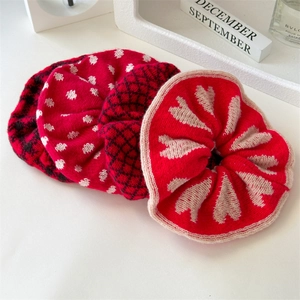 Three-piece red knit scrunchie set featuring polka dots, plaid, and heart patterns