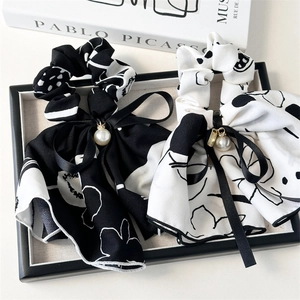 Ink-style floral scrunchies with long ribbons and pearl charms in black and white