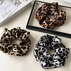 Three-piece set of leopard print hair scrunchies with pleated fabric texture and high elasticity