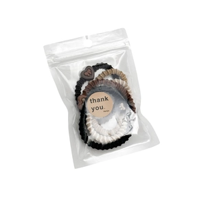 Lot de 5 élastiques à cheveux extensibles tons terre avec breloque cœur en sachet