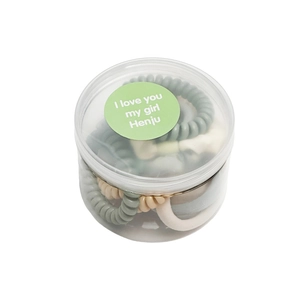 Ten-piece set of spiral telephone wire hair ties in a clear plastic storage container