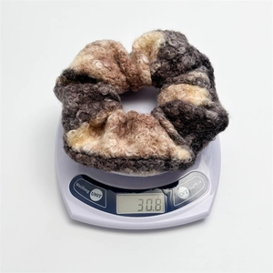 Oversized wool blend scrunchie in multicolor拼接 design weighing 30.8 grams on scale
