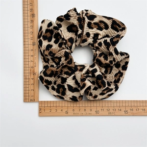 Elastic leopard print scrunchie hair tie with pleated fabric texture and 13cm diameter