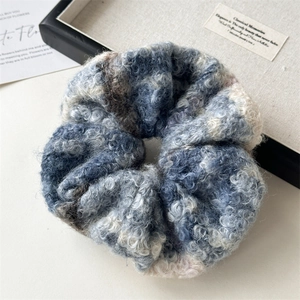 Close-up of wool texture on large blue and grey scrunchie hair accessory