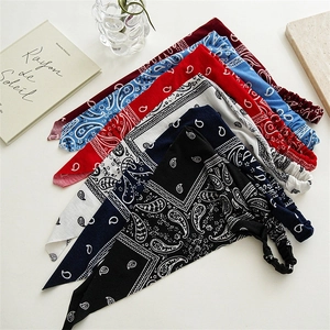 Close-up of paisley patterns and elastic bands on multiple retro style headscarves