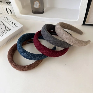 Thick wool padded headbands in various colors featuring retro woven fabric texture