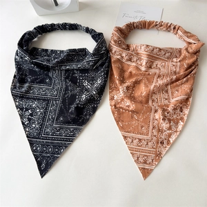 Detail of bohemian paisley print triangle headscarf with elastic hair band in two colors