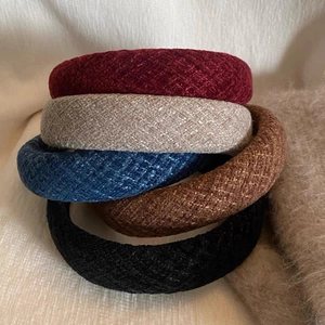 Detailed pile of thick wool sponge headbands in burgundy grey blue brown and black