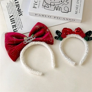 Christmas headbands featuring red velvet bows, golden stars, and sequin reindeer antlers
