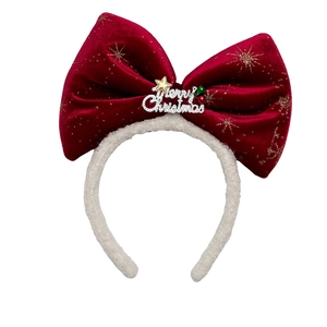 Christmas headband with large red velvet bow, gold stars and Merry Christmas charm