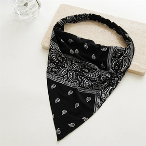 Detail of black paisley bandanna headband featuring soft fabric and elastic back strap