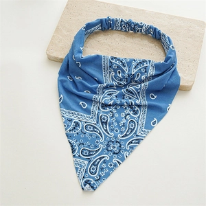 Detail of blue paisley pattern headwrap showing elastic back and cotton texture
