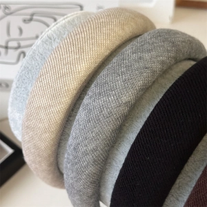 Detail showing the fine knitted texture and soft sponge padding of the padded headbands
