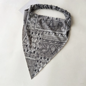 Detailed view of gray bohemian paisley headscarf with elastic band flat lay