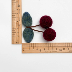 Handmade wool felt cherry hair clip for kids with size measurement on white background