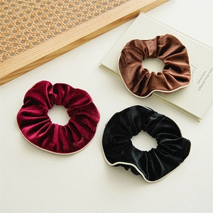 Three-piece set of velvet scrunchies in wine red, brown and black with contrast piping