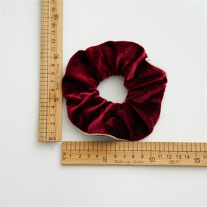 Elegant deep red velvet hair scrunchie with cream piping trim and 11cm diameter