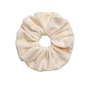 Plush oversized scrunchie in cream velvet fabric for high-elasticity hair styling