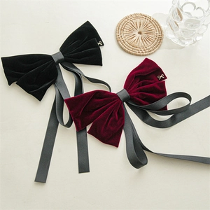 Elegant black and wine red velvet bow hair clips with long ribbons and gold accents