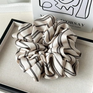 Elegant beige striped satin scrunchie for women with minimalist French aesthetic design
