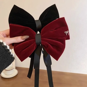 Elegant black and wine red velvet oversized bow hair clips for women's hairstyles