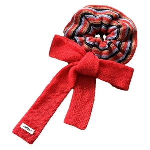 Colorful striped knit scrunchie with a large red bow and Nice label for women