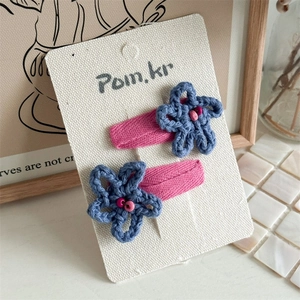 Cute handcrafted blue crochet flower hair clips for girls with pink floral bead accents