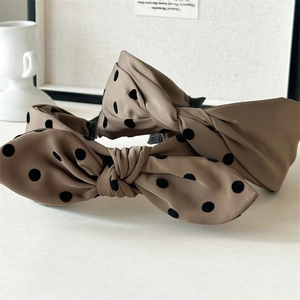 Elegant brown polka dot bow headband for women featuring stylish satin fabric design
