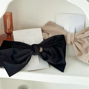 Elegant large velvet bow hair clip in black and beige with vintage French style