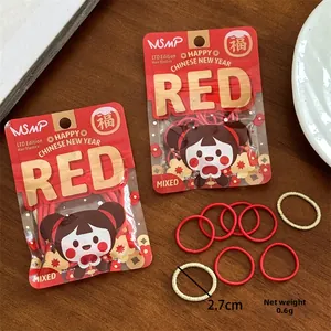 Détail d'élastiques à cheveux rouges et dorés du Nouvel An chinois, 2,7 cm et poids 0,6 g