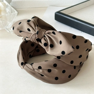 Elegant coffee brown polka dot bow headband for women featuring a retro silky finish