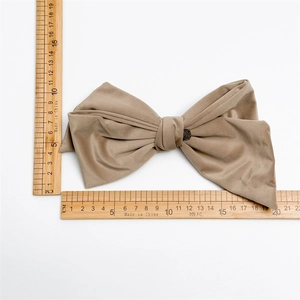 Detailed view of the khaki velvet bow hair clip showing dimensions of 19.5cm by 10.5cm