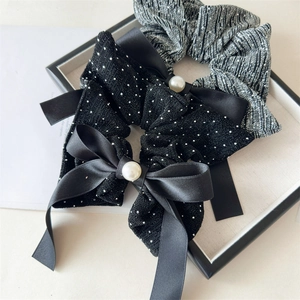 Elegant fabric scrunchies set featuring black sequin bow with pearl and silver pleated style