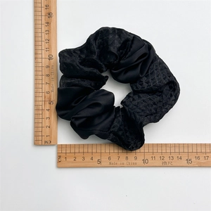 Black satin hair scrunchie with diamond texture pattern and measuring ruler scale